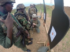 Burundian soldiers inspect targets and receive sight adjustments from Marines to their rifles during a live fire range in Bujumbura, Burundi, Dec. 2, 2014. Marines and Sailors with Special Purpose Marine Air Ground Task Force Crisis Response-Africa trained alongside the Burundi National Defense Force, providing expertise in logistics and engineering disciplines for approximately 3-months from October to December. (Courtesy Photo) - http://www.dvidshub.net/image/1710317/burundi-us-forces-enhance-regional-security-somalia#.VKm6GvmLe1E