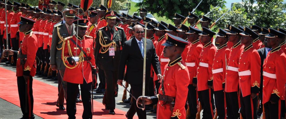 ( Photo : Sudan's President Omar al-Bashir, center, inspects the guard of honor after his arrival at State House in Entebbe, Uganda Monday, Nov. 13, 2017. Rights groups on Monday urged Ugandan authorities to arrest the visiting president of Sudan, who has long been wanted by the International Criminal Court for serious crimes. (AP Photo/Ronald Kabuubi) )